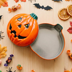 orange storage box with hinged lid and jack-o'-lantern motif