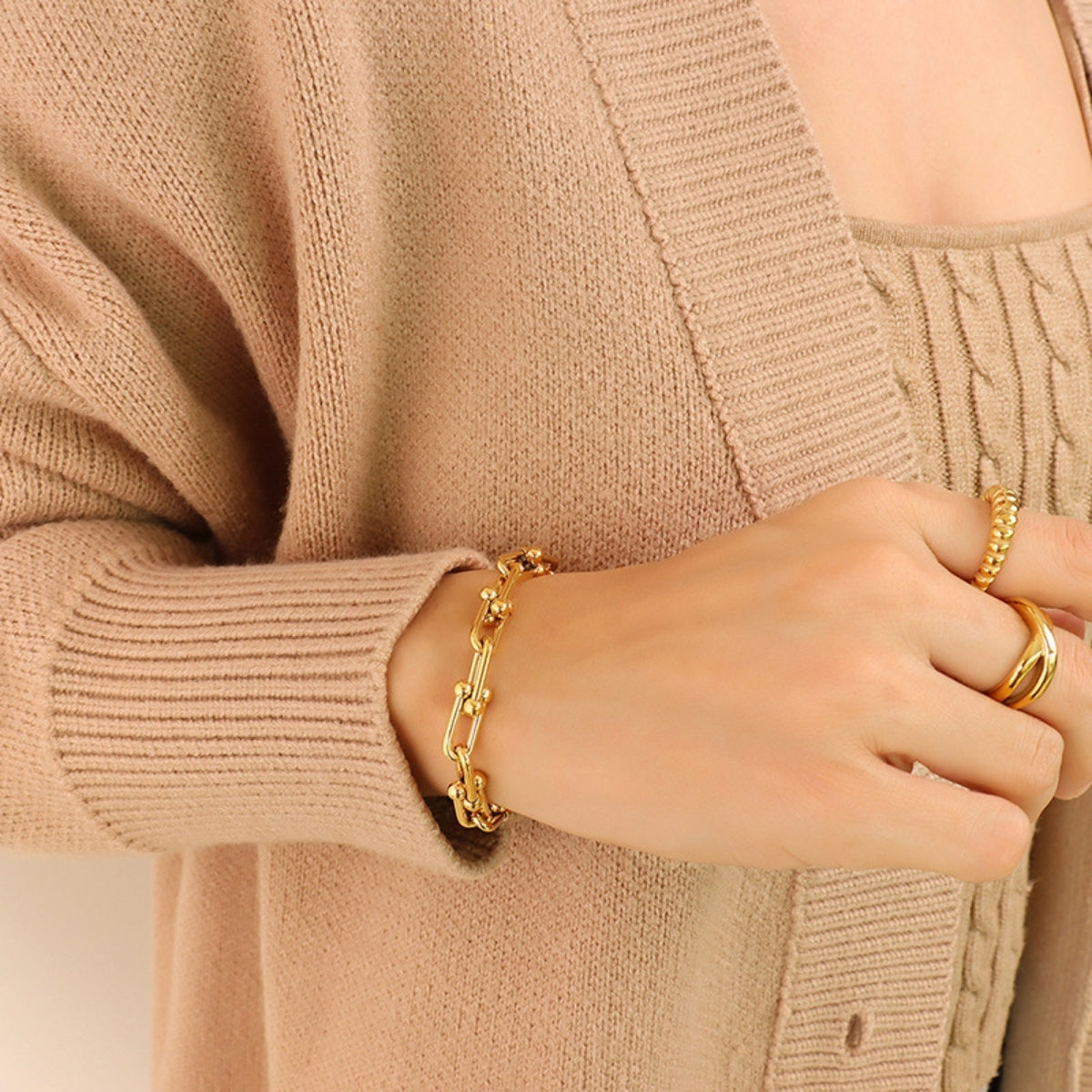 Gold sculptural link chain bracelet with bead accents, 18k gold-plated.