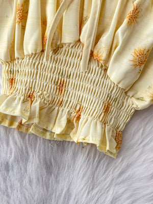 Floral ruffled crop top with smocked waist and tie detail