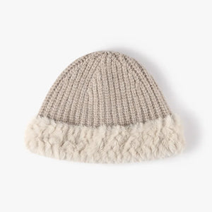 Beige ribbed knit beanie with fluffy faux fur trim