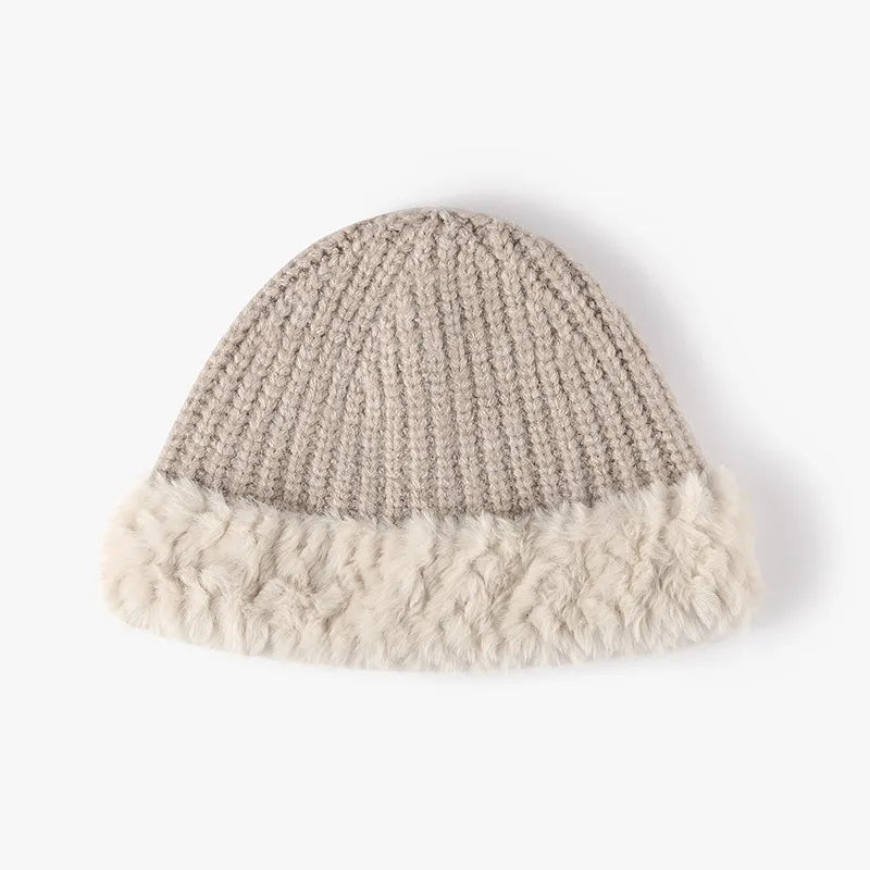 Beige ribbed knit beanie with fluffy faux fur trim