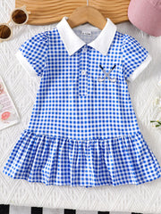 Baby blue gingham polo dress with white collar, short sleeves, and embroidered golf clubs.