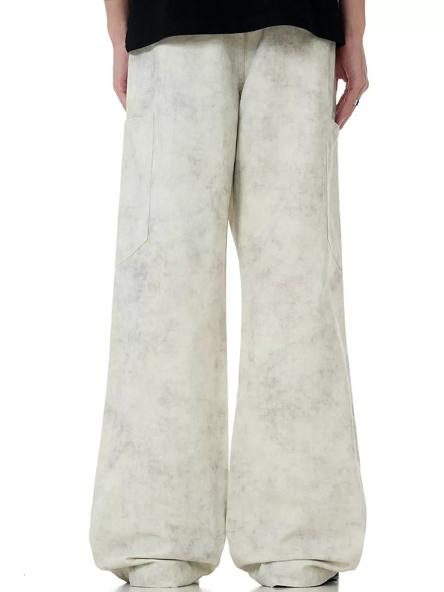 Men's wide-leg pants in marble wheat with a textured pattern and utility pockets.