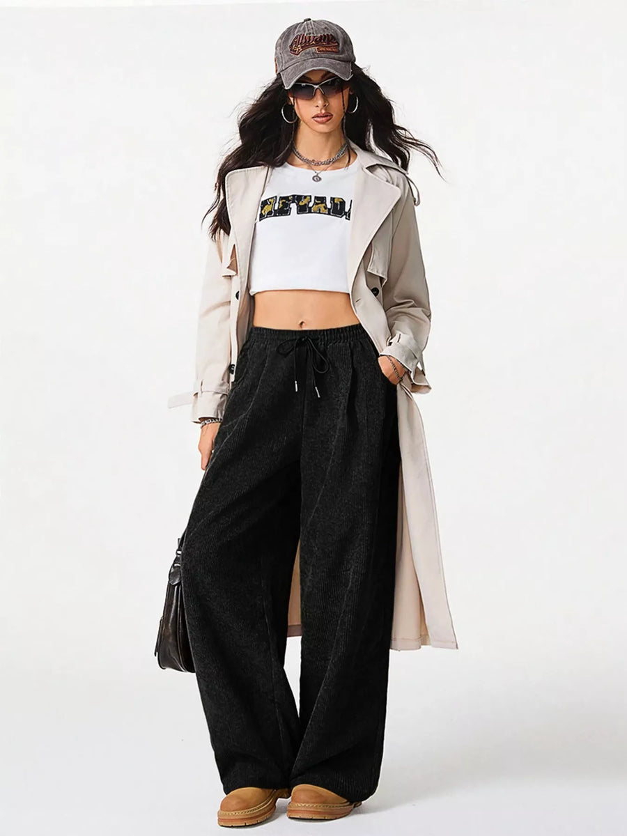 Relaxed black corduroy drawstring pants with a wide leg