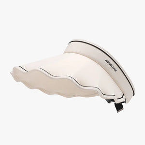 Scalloped brim sun visor in ivory with black trim and text detail.