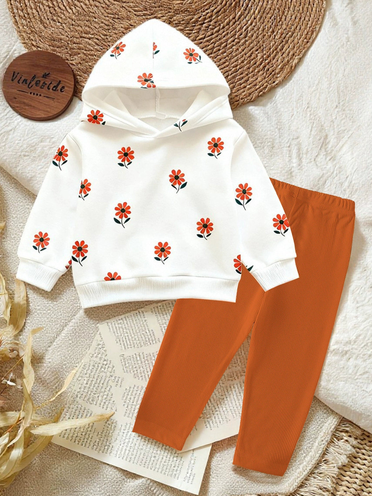 White floral print baby hoodie with orange ribbed pants
