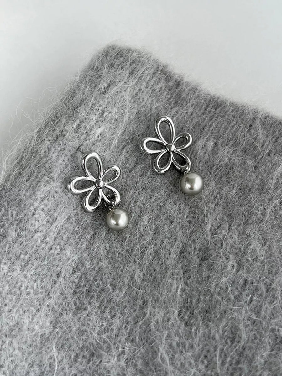 silver earrings with flower motif and null