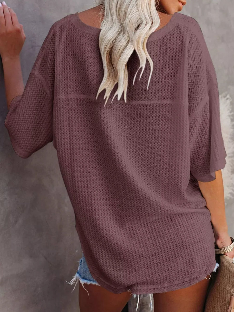 Waffle knit relaxed v-neck t-shirt in maroon with short sleeves.