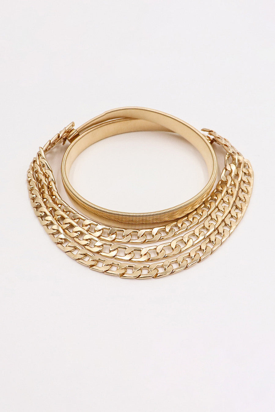 Gold chain belt with elastic band and multiple layered curb chains.