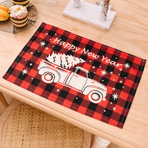 Red and black buffalo plaid placemat with white truck and trees graphic