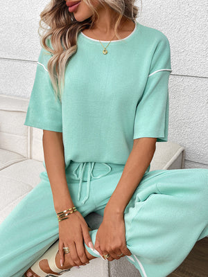 Light green knit loungewear set with crew neck top and drawstring pants.