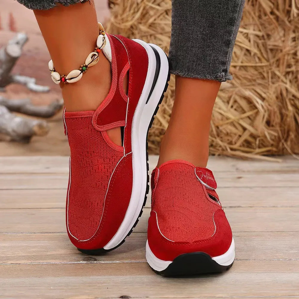 Red mesh platform slip-on sneakers with cutout details and white soles.