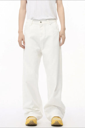 White denim wide-leg trousers with elastic waist and button fly
