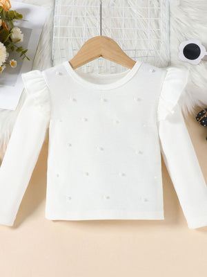 White ribbed long sleeve top with pearl details and ruffled shoulders