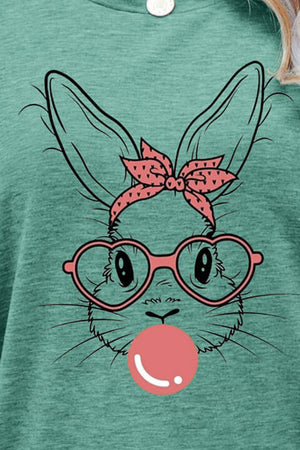 Misty Blue graphic tee with a bunny wearing heart glasses and blowing bubblegum.