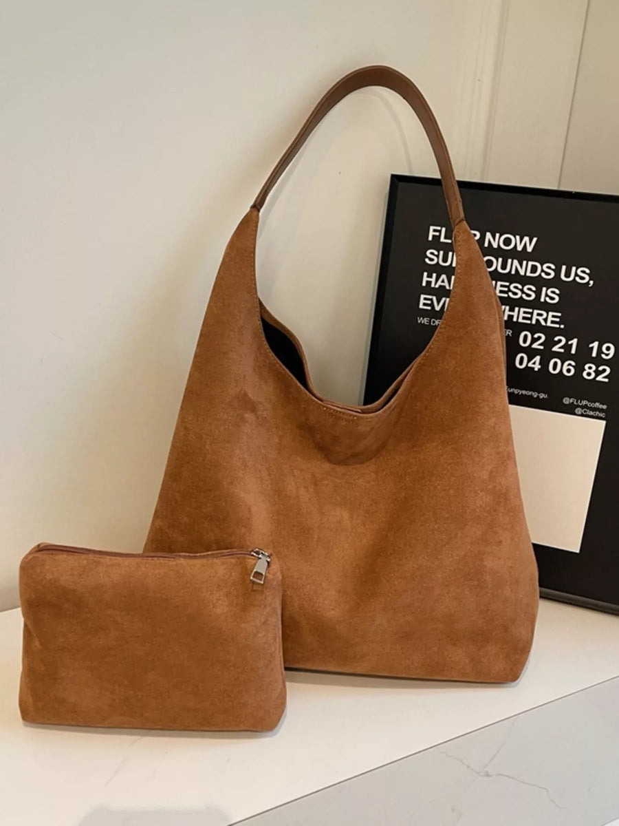 Brown suede hobo tote bag with matching mini pouch.