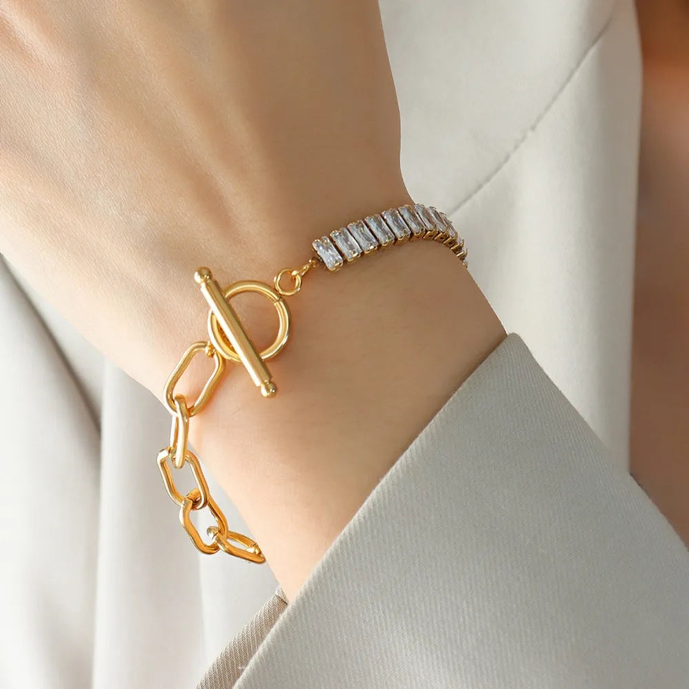 Gold chain toggle bracelet with baguette zirconia accents