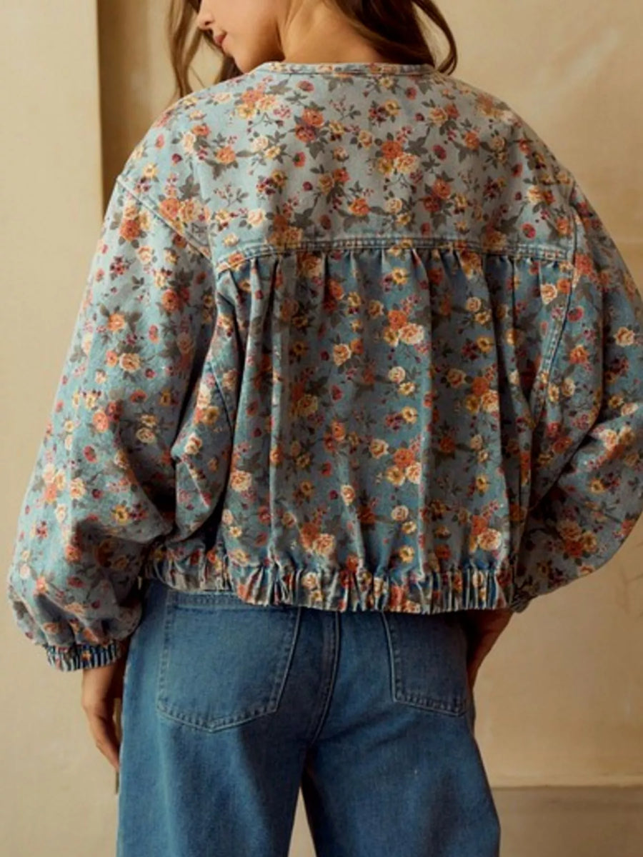 Cropped denim trucker jacket with floral print, elasticated hem and cuffs, and gathered back detail.