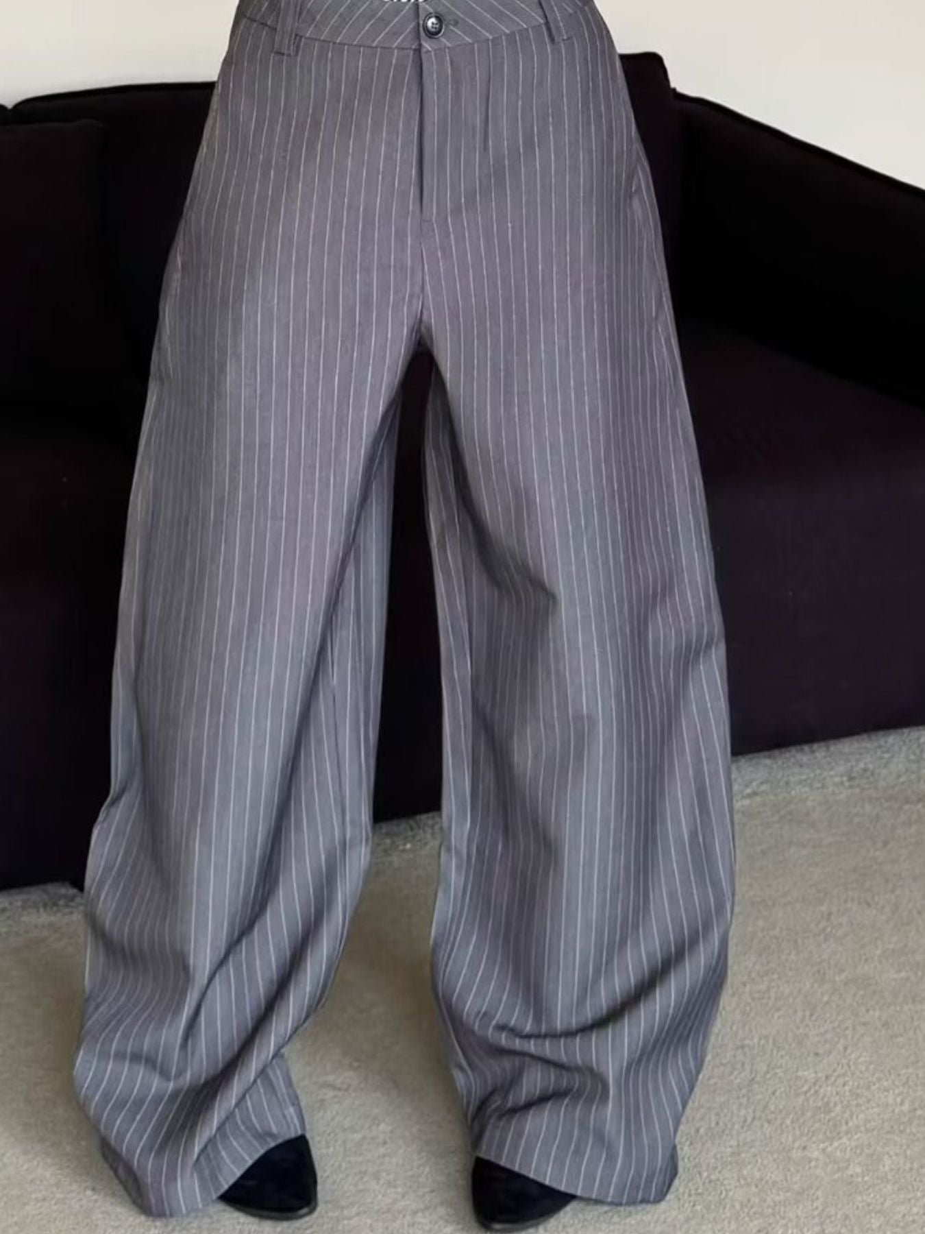 Men's grey pinstripe wide leg sweatpants with a relaxed fit.