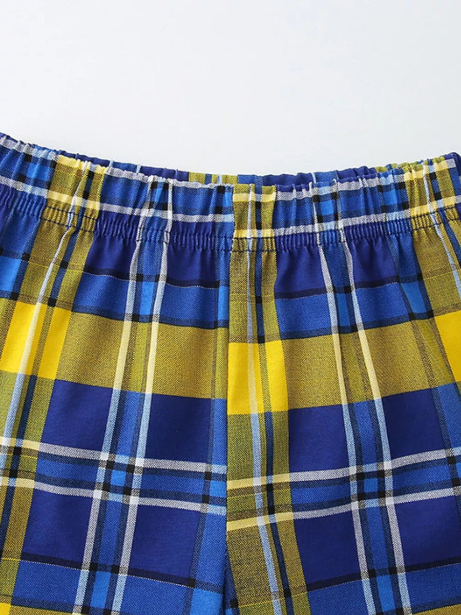 Toddler blue and yellow plaid cotton shorts with elastic waistband.
