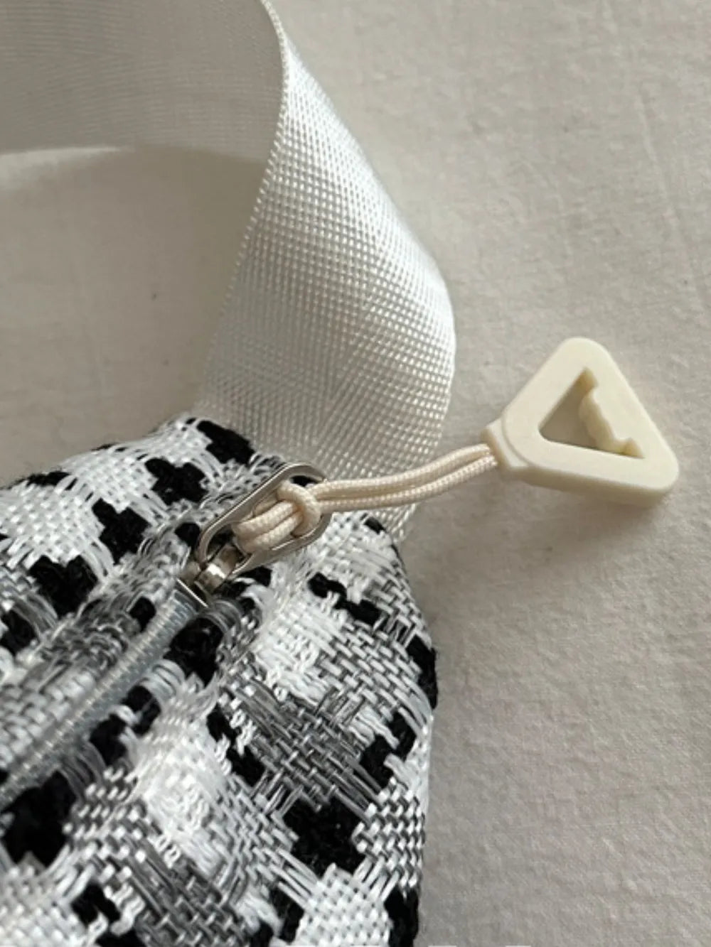 Textured houndstooth belt bag with zipper detail