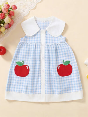 Sky blue gingham toddler dress with white collar and apple appliqués.