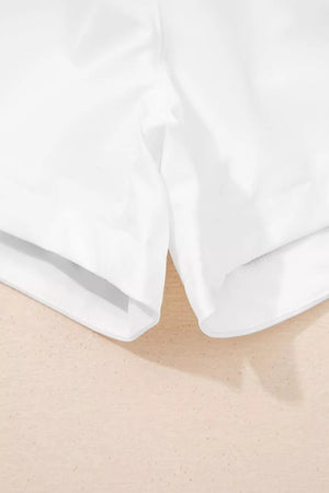 White ribbed-waist high rise relaxed shorts with a comfortable, casual fit.