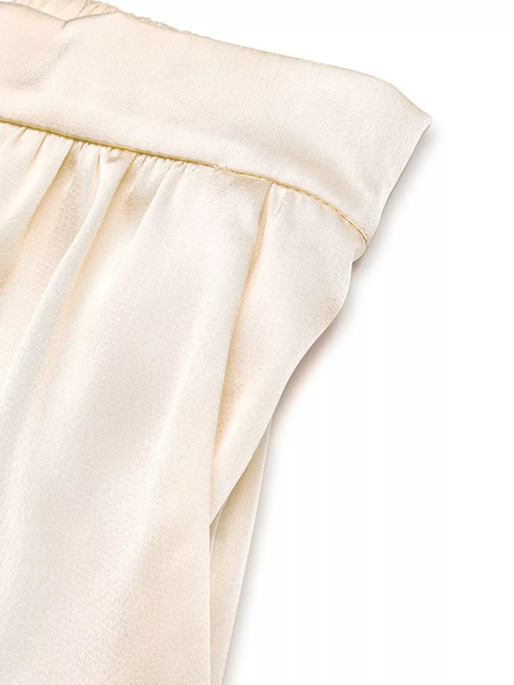 Champagne satin twist-front top and flowing pants set with ruched waistband detail.