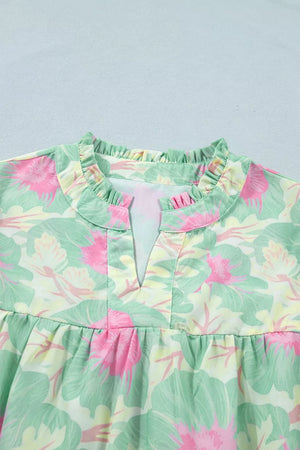 Pastel floral print polyester blouse with ruffled neckline and V-neck detail