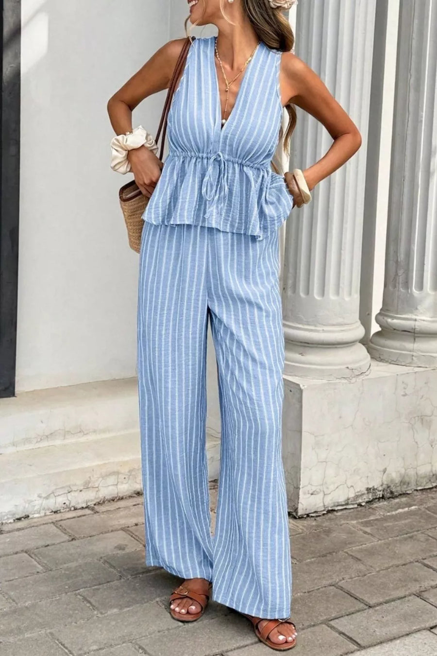 Light blue striped two-piece set with peplum top and wide-leg pants