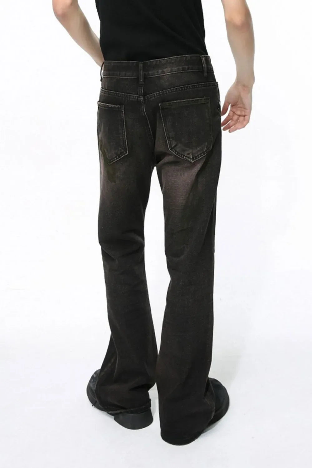 Dark wash bootcut denim jeans with a faded effect and flare leg, shown from the back.