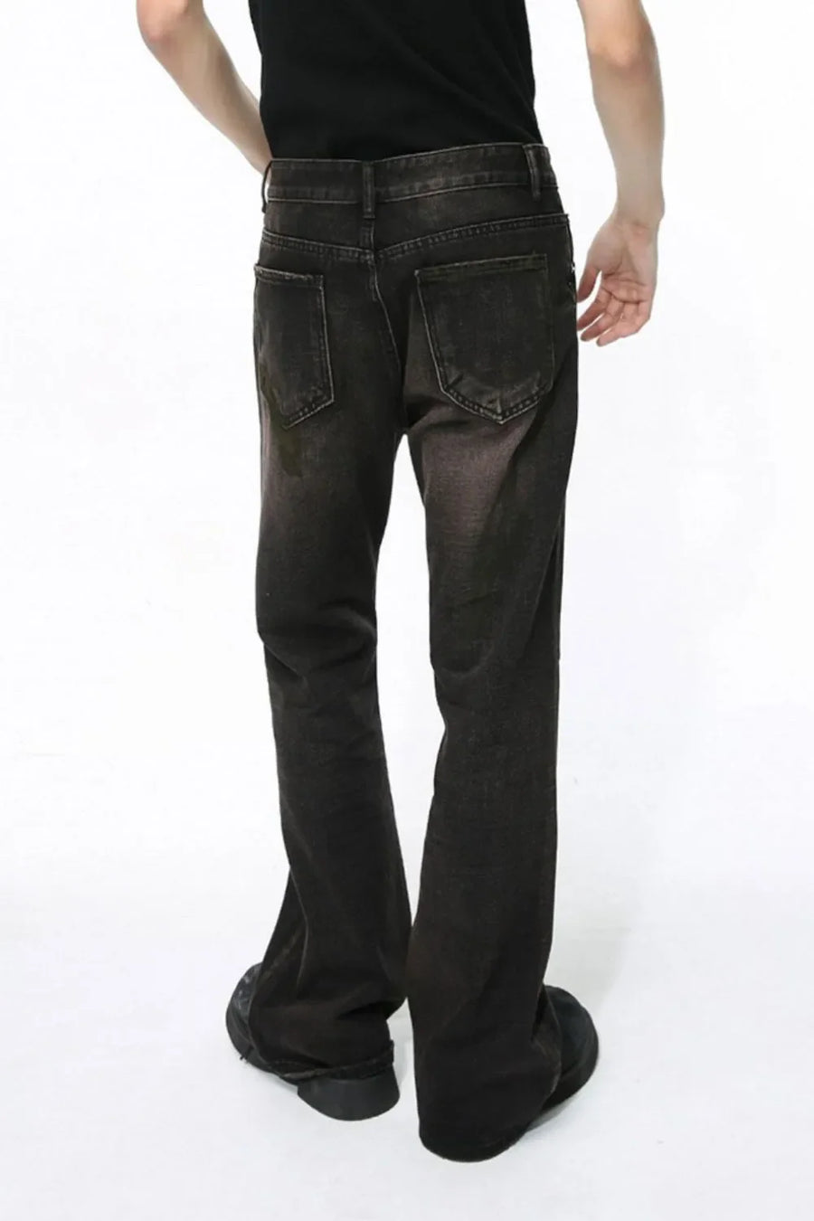 Dark wash bootcut denim jeans with a faded effect and flare leg, shown from the back.