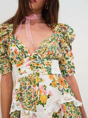 Ruched floral tie-front dress with half sleeves, lace trim, and a sweetheart neckline.