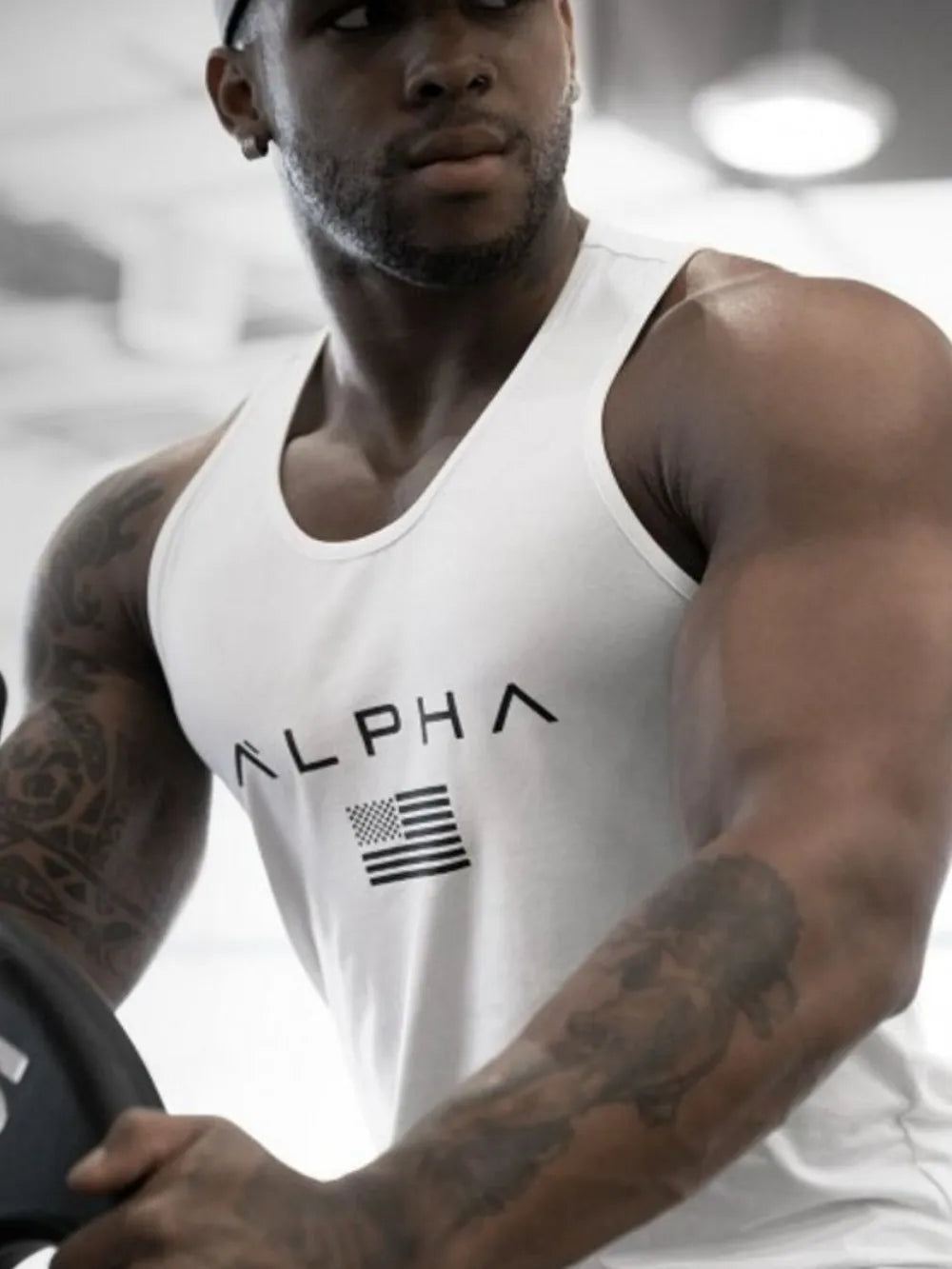 White Alpha graphic muscle tank top with American flag detail.