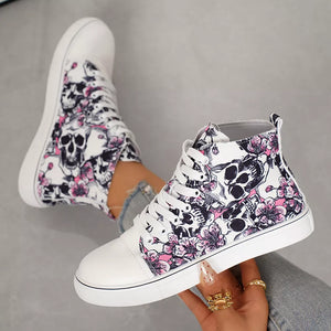 White high-top sneakers with a skull and floral print, lace-up closure.