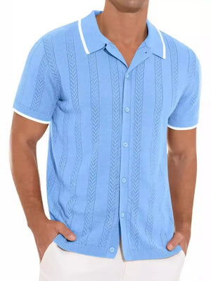 Blue textured knit polo shirt with white contrast trim and short sleeves.
