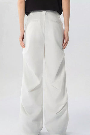 White wide-leg sweatpants with pockets and a relaxed fit.