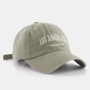 Green baseball cap with white Los Angeles Vintage Made embroidery and adjustable strap