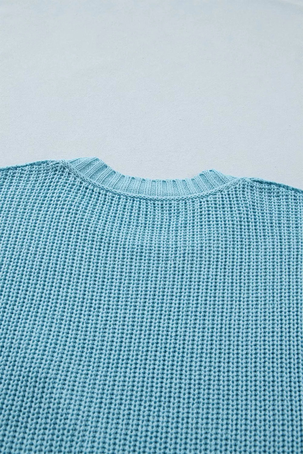 Light blue ribbed knit sweater top with crew neck