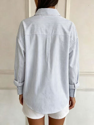 95% polyester, 5% spandex Care instructions: Machine wash cold button-down shirt in White with relaxed silhouette