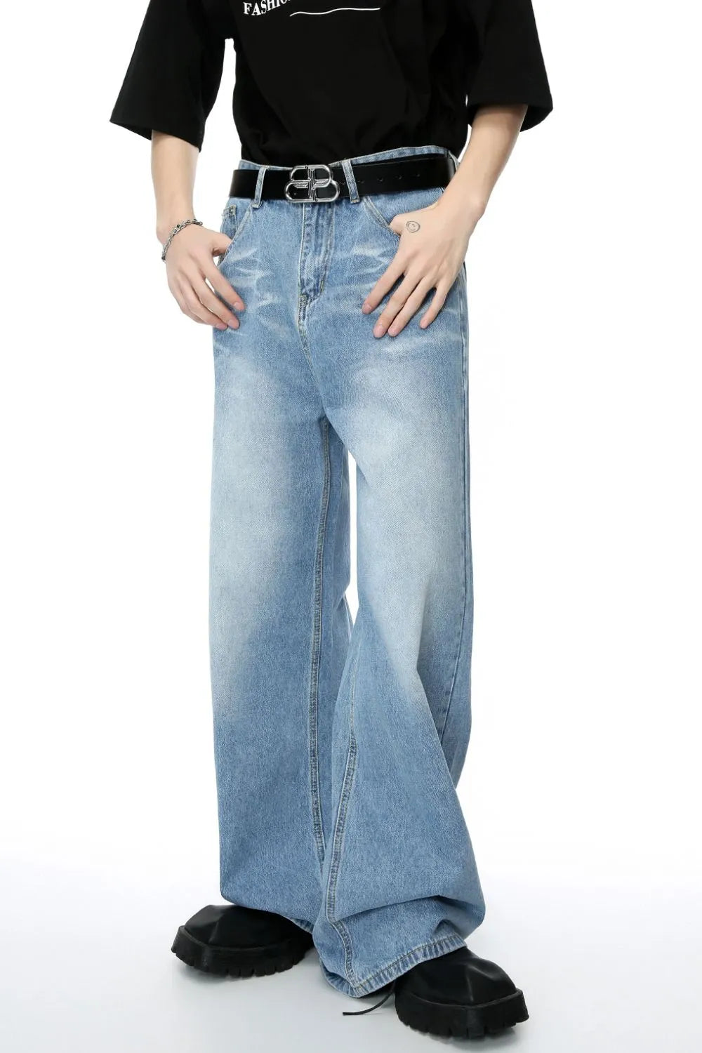 Oversized denim palazzo jeans in medium wash with subtle fading and a wide leg