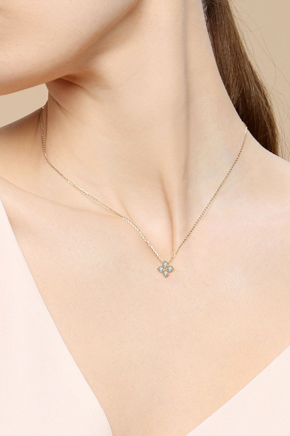 Gold necklace with a four-petal diamond blossom pendant, 925 sterling silver.