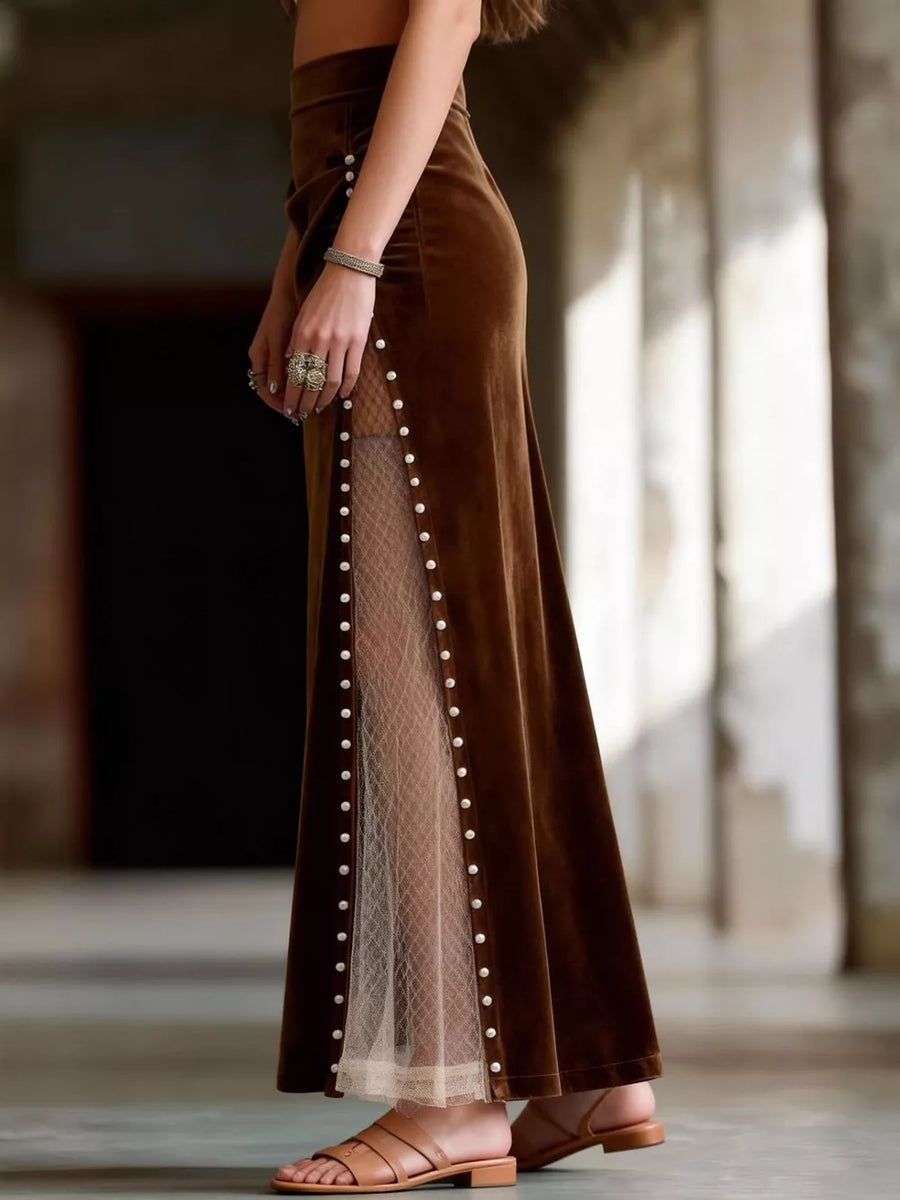 Dark brown velvet maxi skirt with pearl trim and sheer lace paneling.