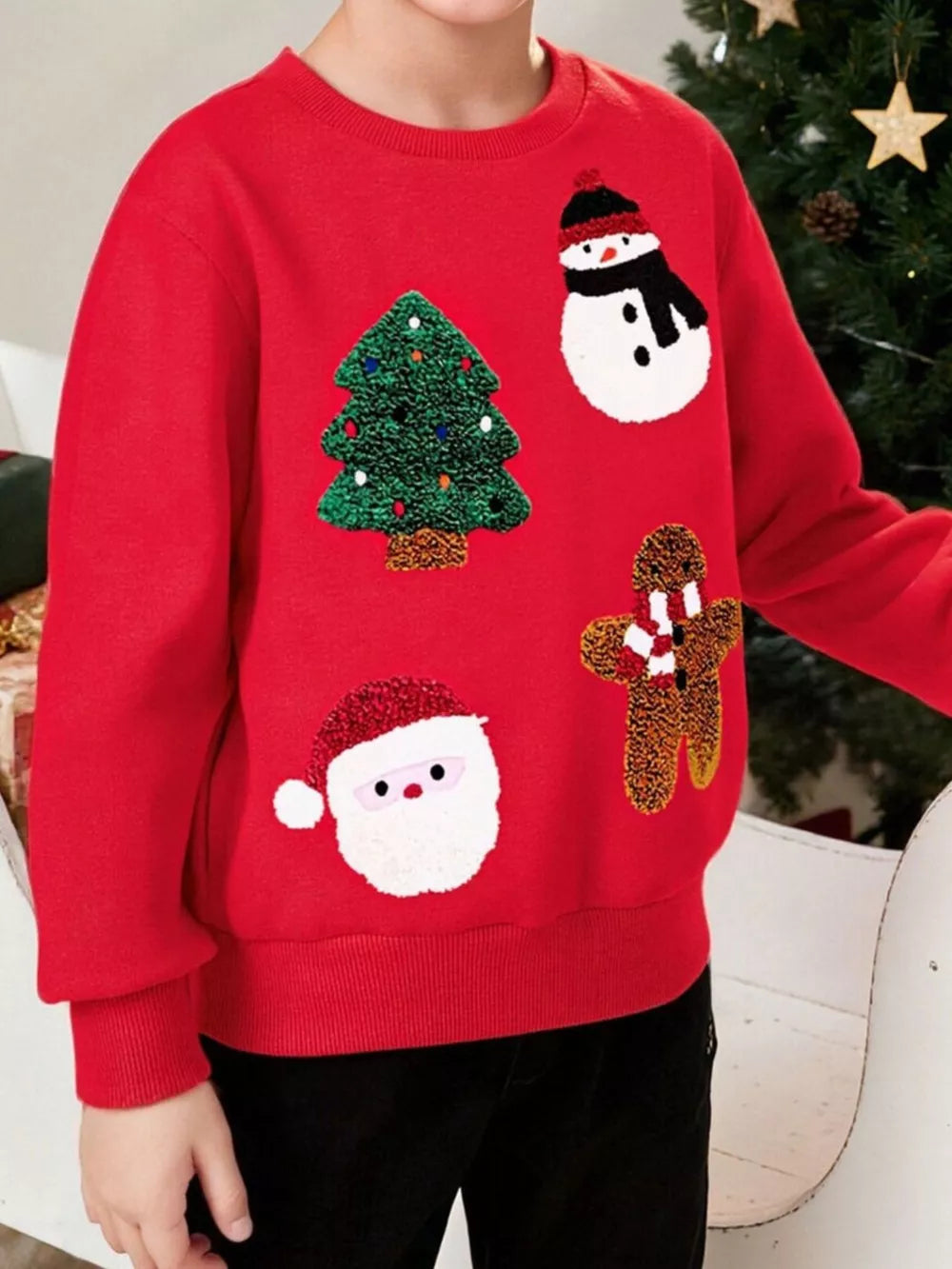 Red Christmas sweatshirt for kids with Santa, snowman, gingerbread man, and tree appliques.