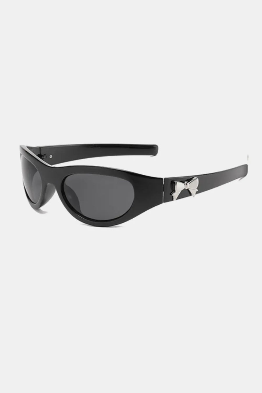 Black sporty shield sunglasses with a silver bow embellishment on the temple.