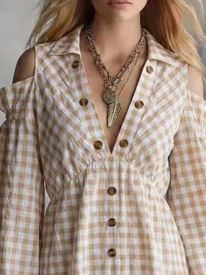 cream mini dress featuring decorative button and gingham