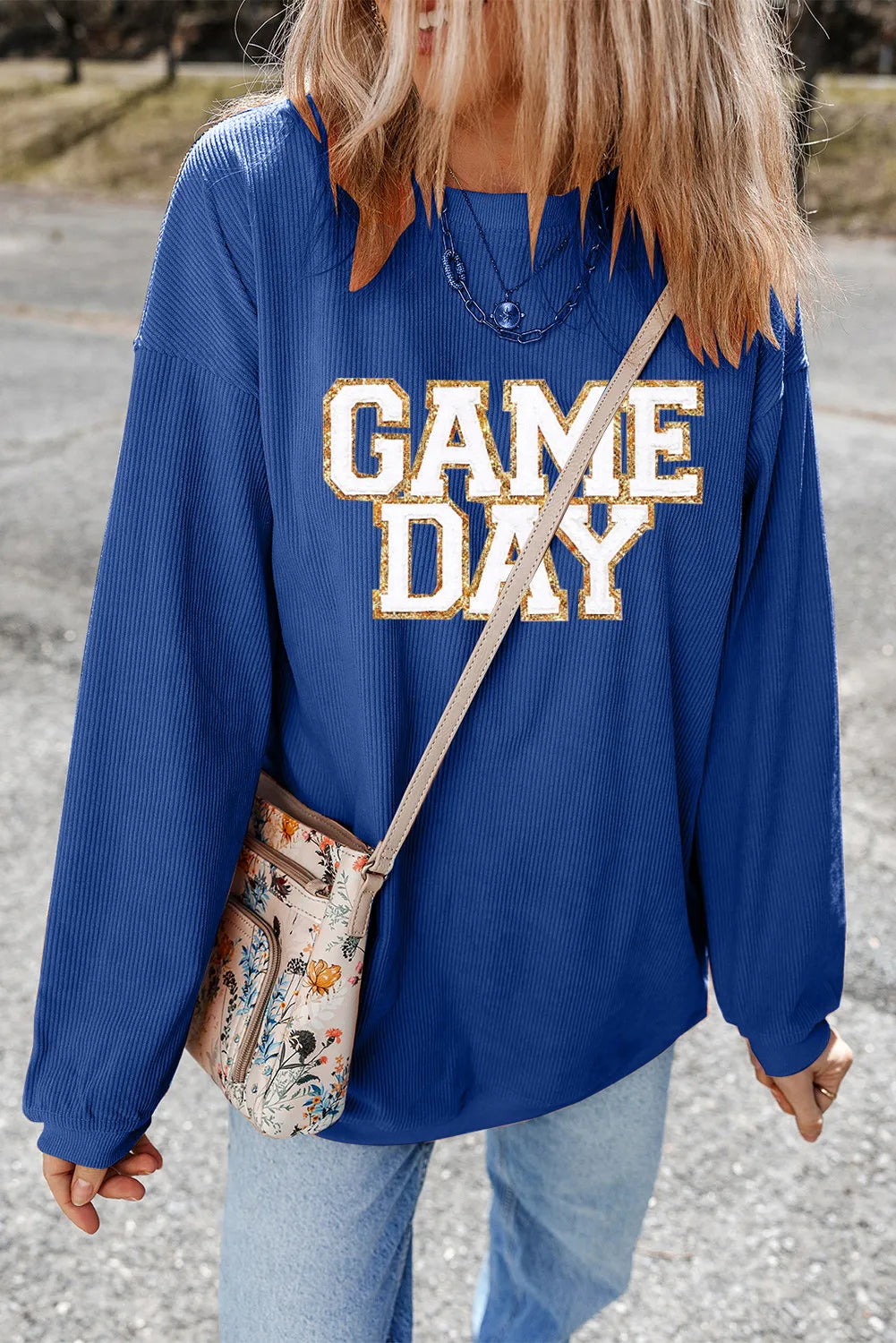 Peacock blue ribbed sweatshirt with white and gold glitter "GAME DAY" graphic.
