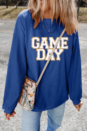 Peacock blue ribbed sweatshirt with white and gold glitter "GAME DAY" graphic.