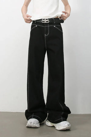 Black relaxed fit denim jeans with contrast white stitching and a wide leg.