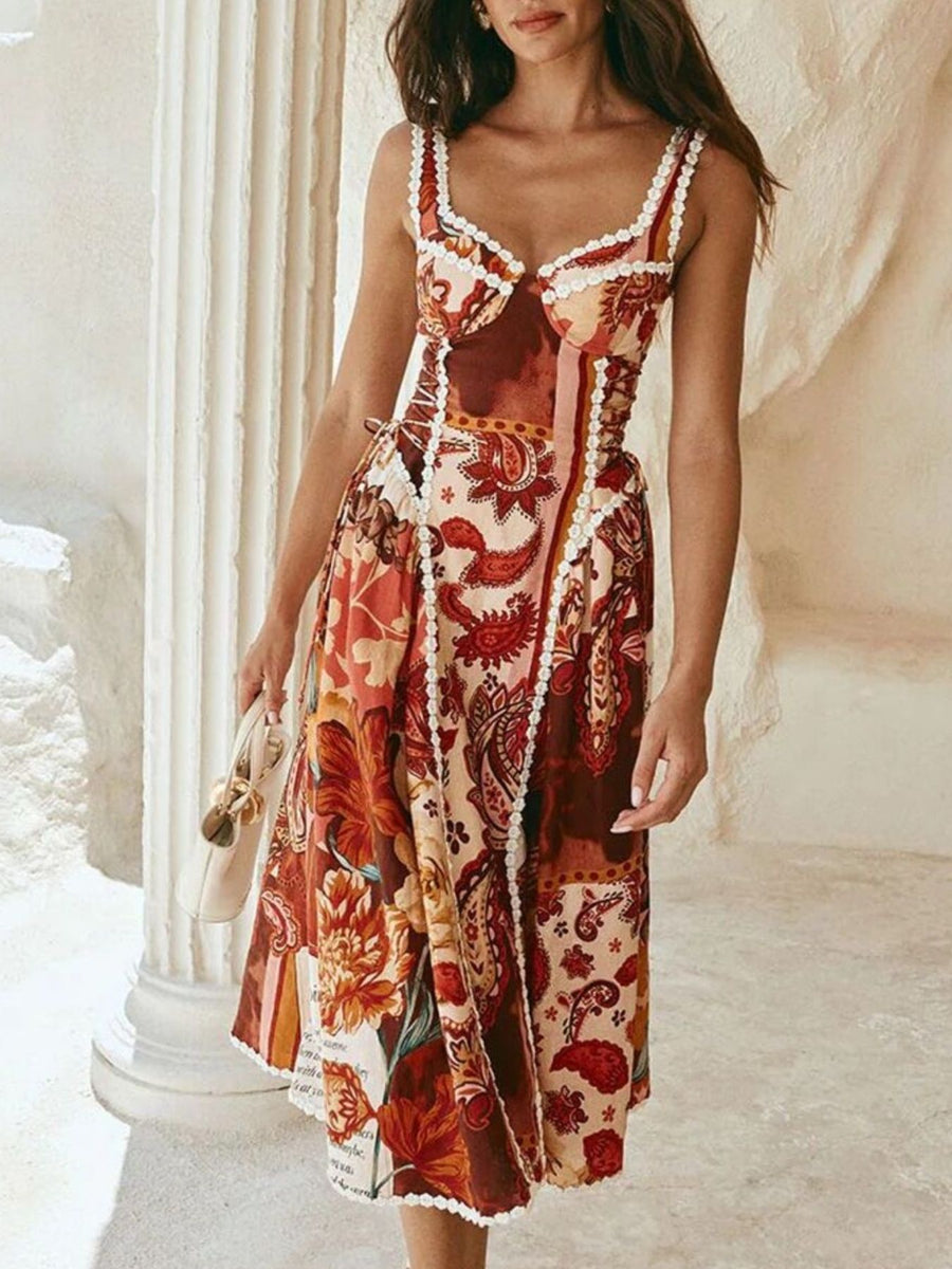 Midi dress with paisley and floral print, lace trim, and sweetheart neckline.